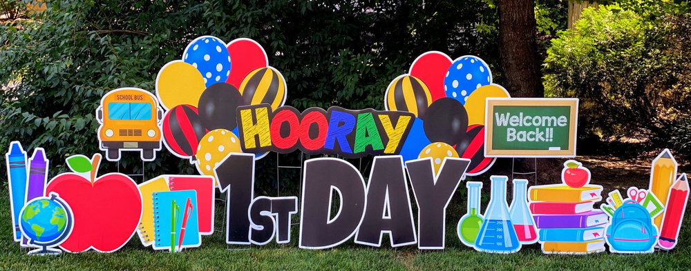 hooray 1st day, welcome back yard sign with bright colors showing apple, crayons, books and balloons