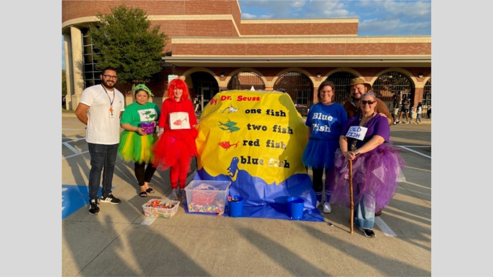 adults dressed up as characters from the book, One Fish, Two Fish, Red Fish, Blue Fish