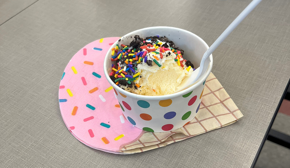 ice cream cone shaped napkin with bowl of ice cream on top, with sprinkles!