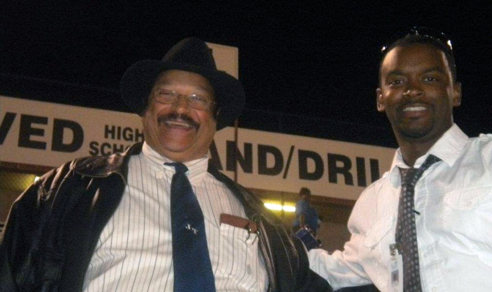 two African American men wearing white shirts and ties