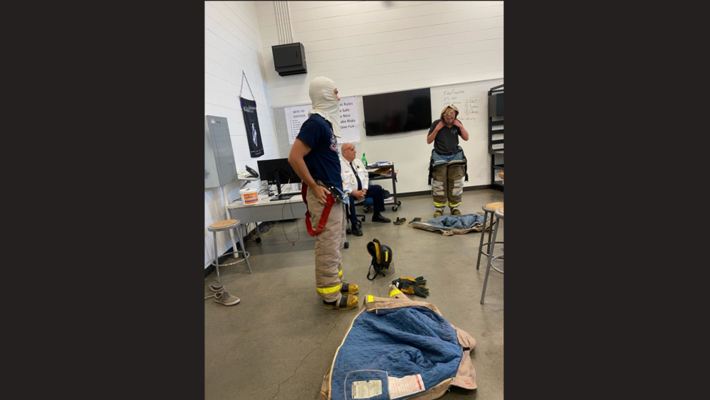 ​Firefighting students practicing how to “gear up” in under 60 seconds!​