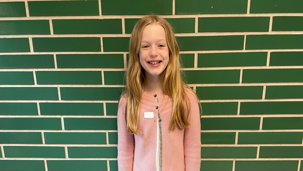 Mae Mae Ewing photo in front of brick wall