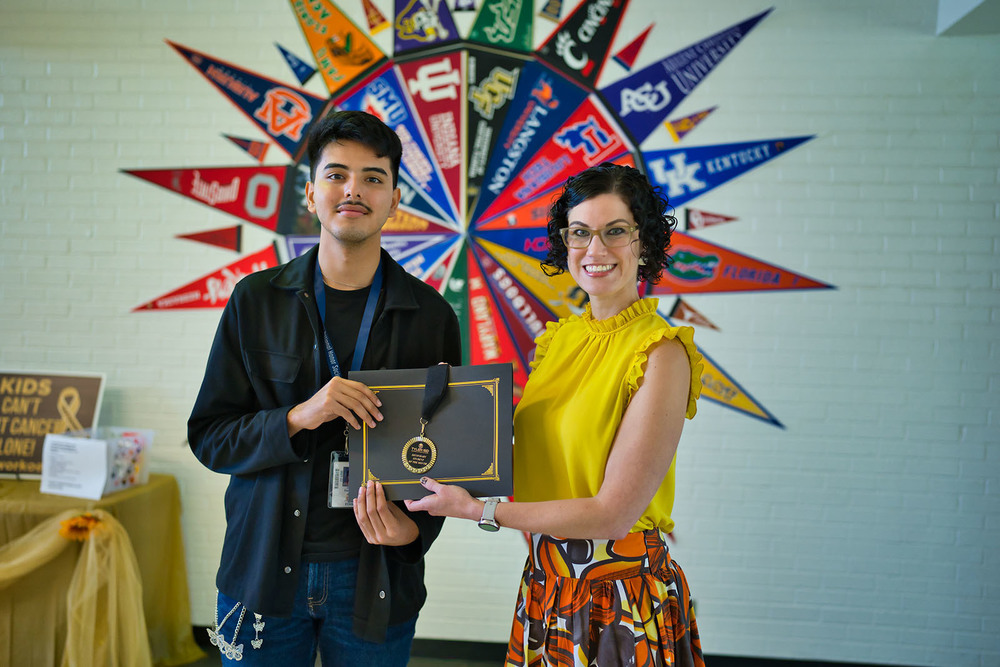 Early College High School senior Jesie Espinoza standing next to principal Amanda Hortman