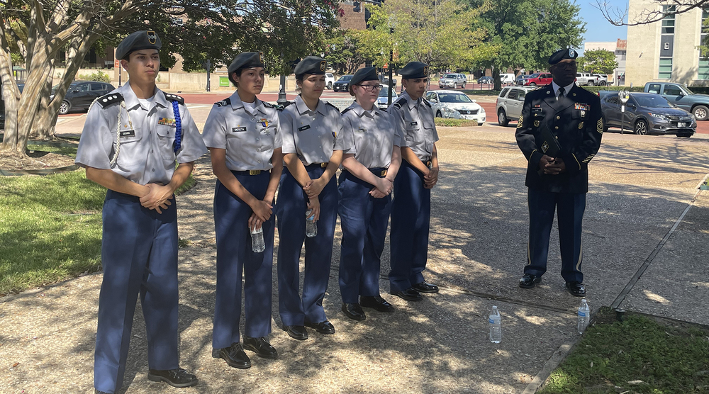 JROTC Cadets standing in uniform on a sidewalk