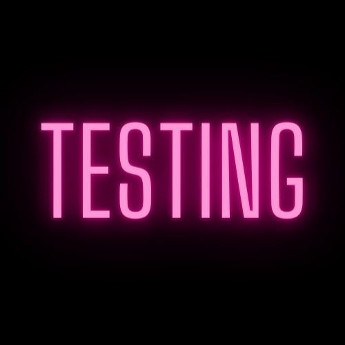 black poster with pink letters TESTING