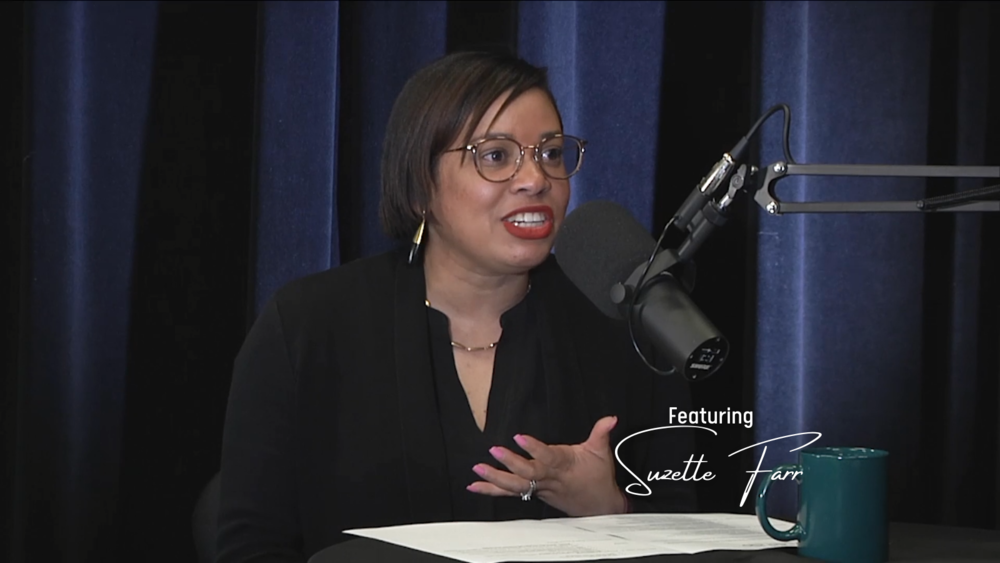 Suzette Farr sitting with microphone in front of her