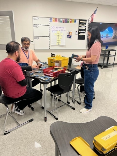 Three teachers at a table