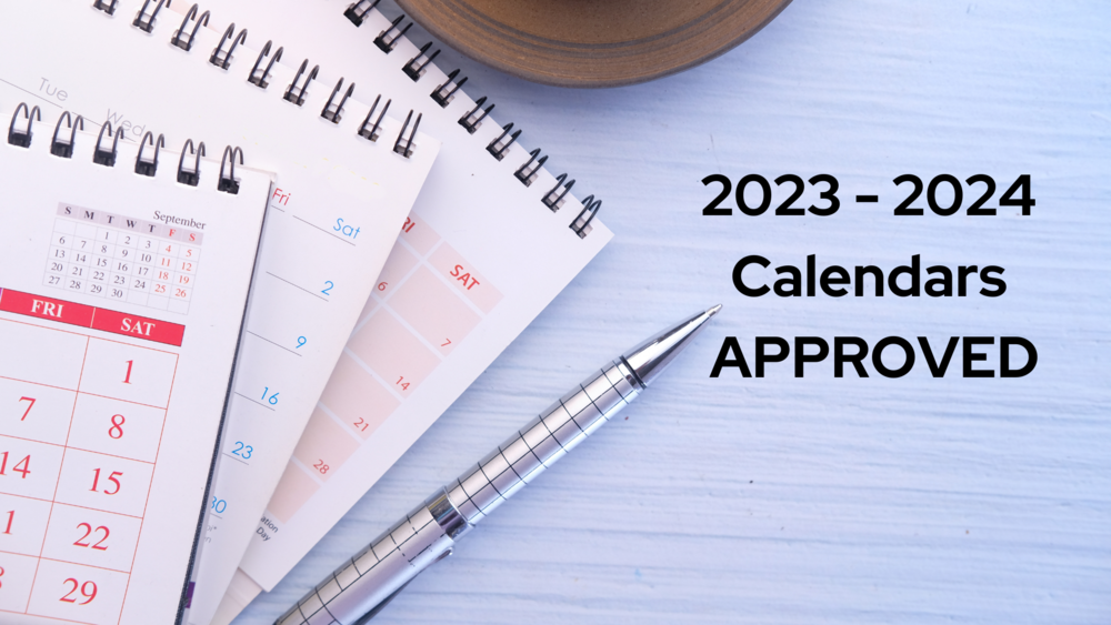 calendars laying on a table next to a pen. 2023-2024 calendars approved