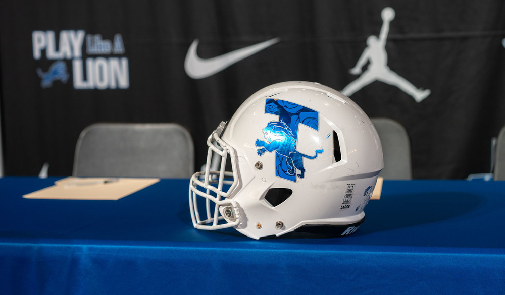 Tyler High football helmet on a table with a blue tablecloth