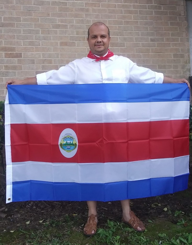 José Salas Gamboa holding his flag of Costa Rica