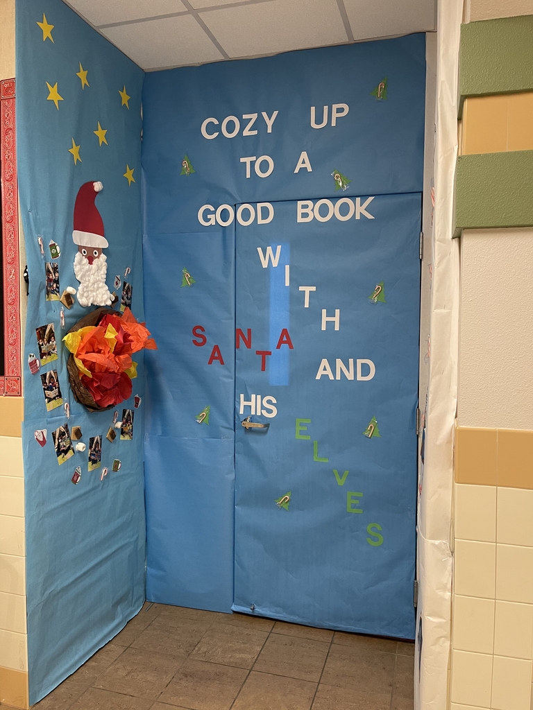 A door decorated with Santa for Christmas.