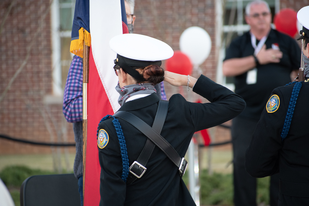 JROTC saluting the flags.