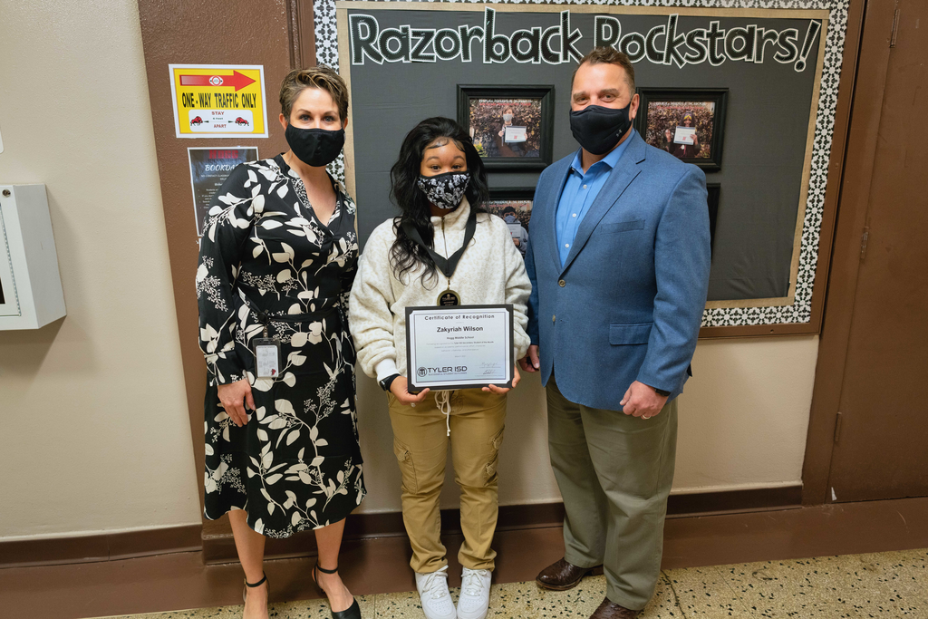 student of the month Zakyriah with her principal