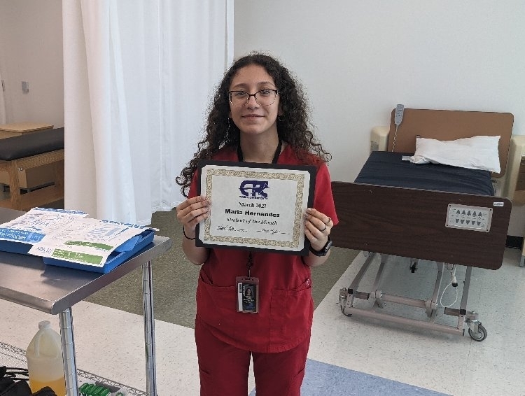 Student receiving award
