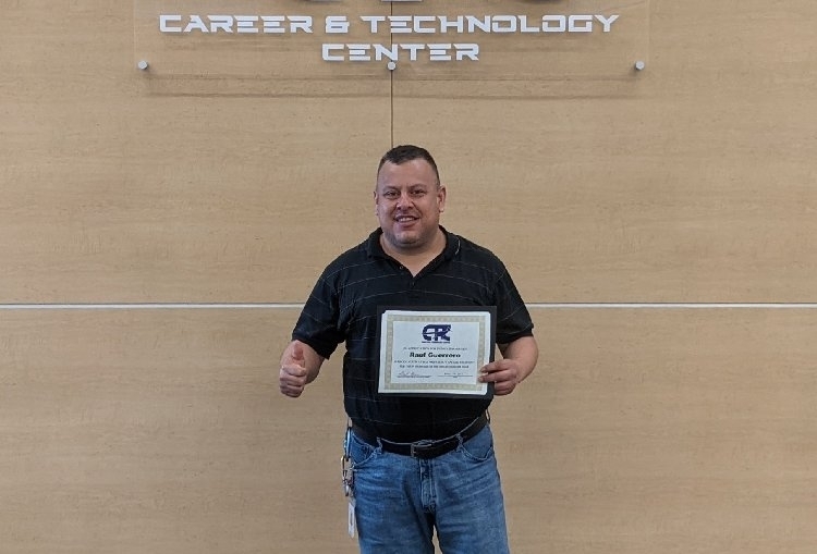 Staff member receiving award.