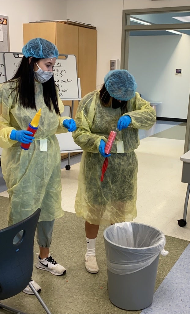students clearing tube of blocked artery lab