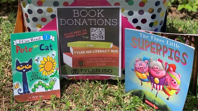 books staged in the grass to donate