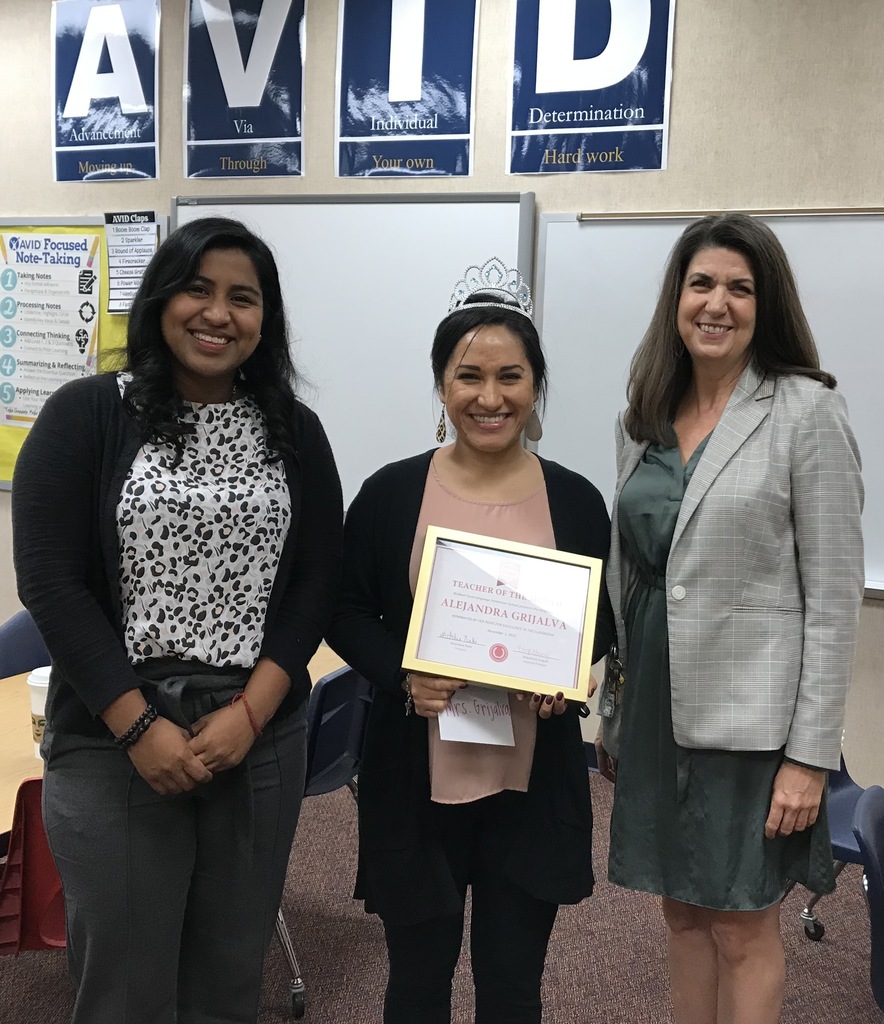 Gretchen Nabi and Elizabeth Gomez award Ms. Grijalva with her certificate of recognition. 