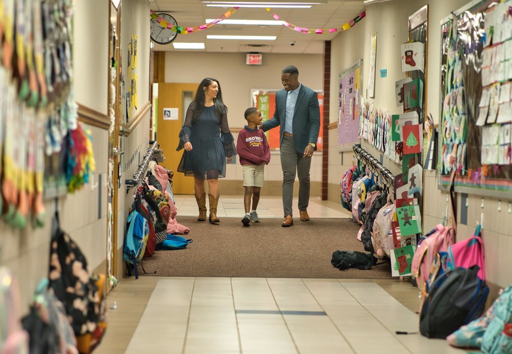 parents walking with student through halls at Birdwell
