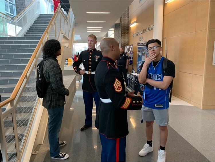 2 students talking to marines