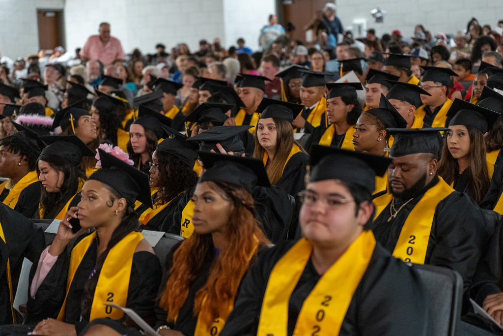students sitting at graduation