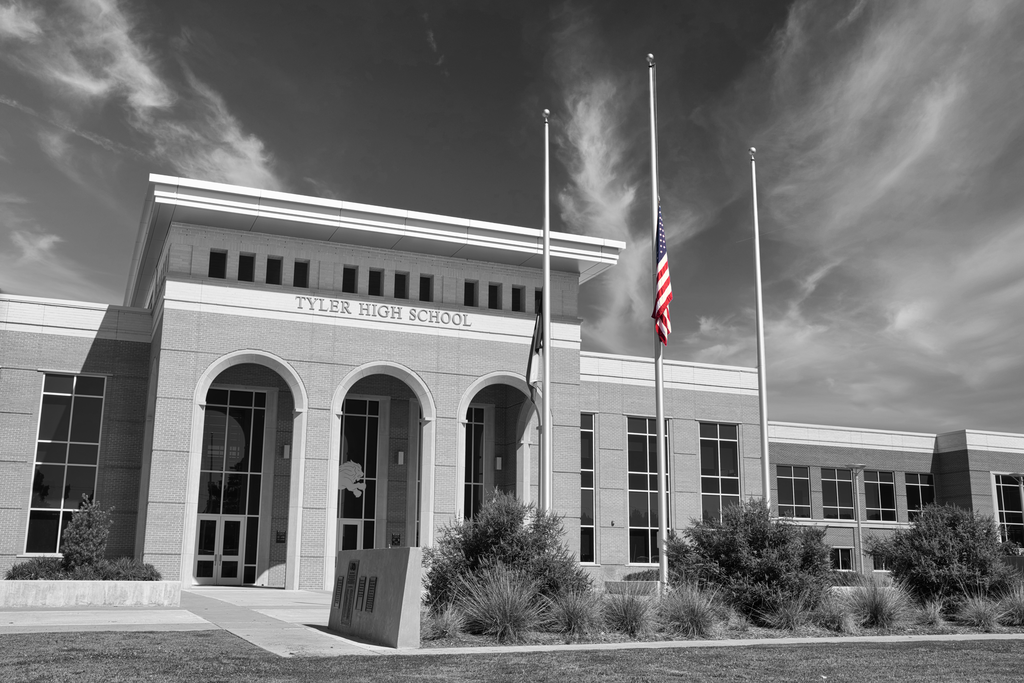 Tyler High School in black and white with US flag in color