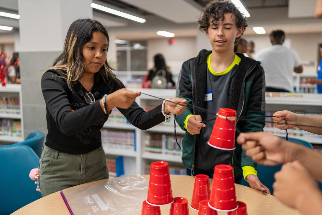students stacking cups