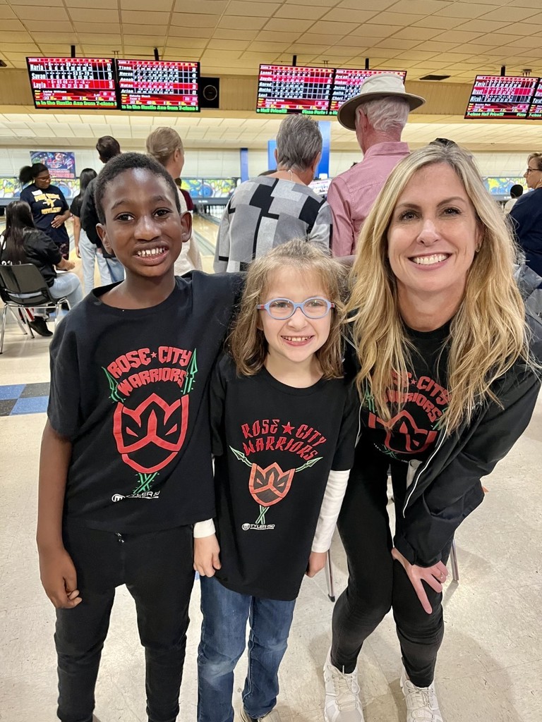 students with teacher at bowling alley
