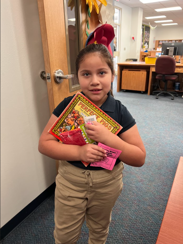 1st grade student winning a prize for being caught reading
