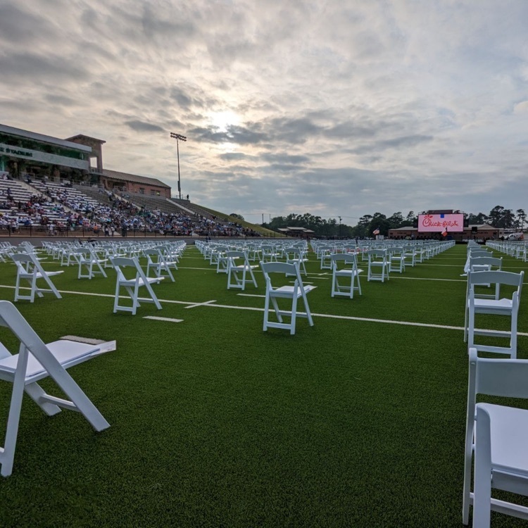 rose stadium in the evening with chairs lined for graduation 