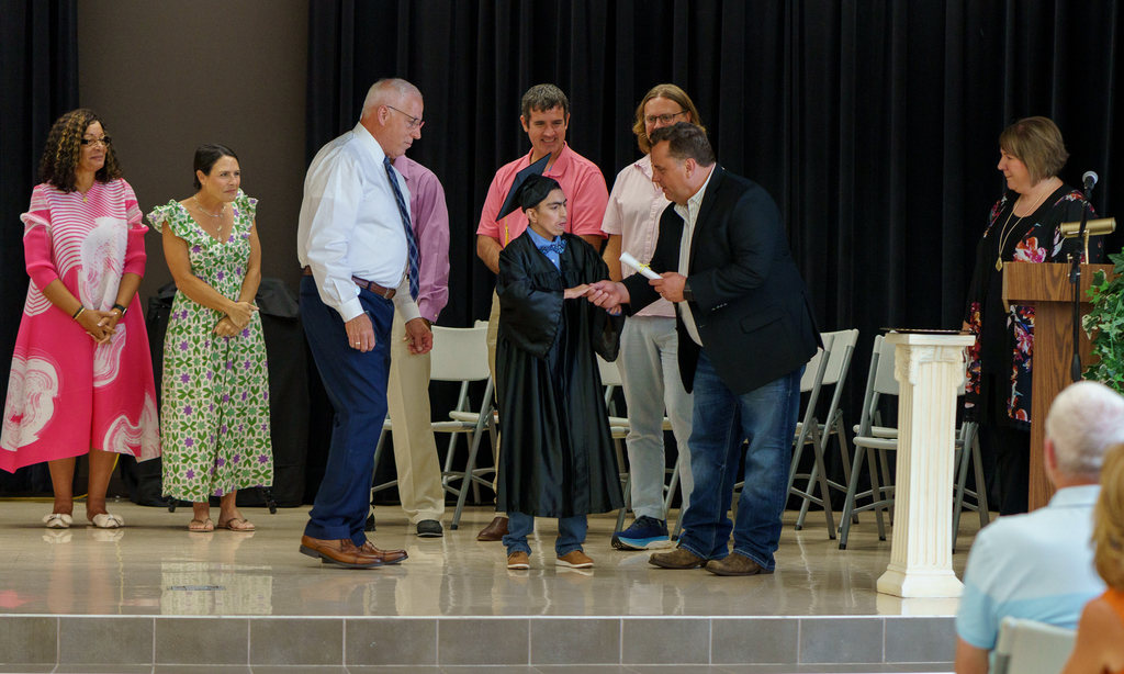 Boshears student accepting diploma.
