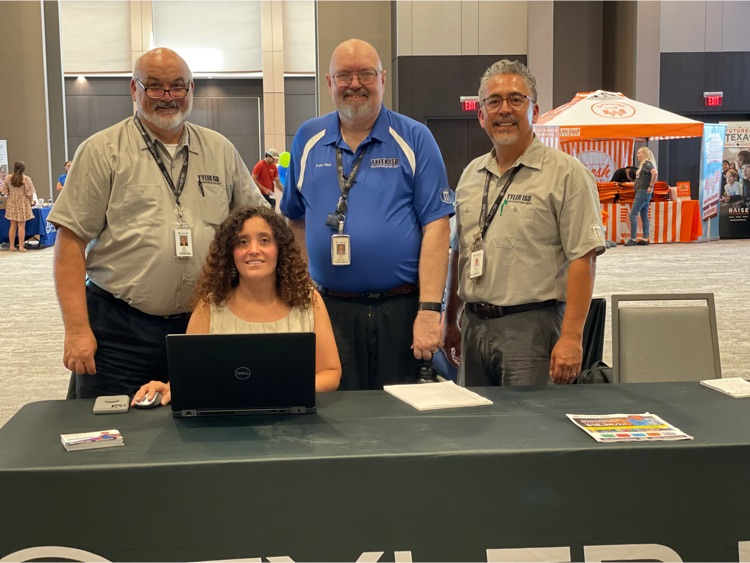 staff sitting behind Tyler ISD booth table