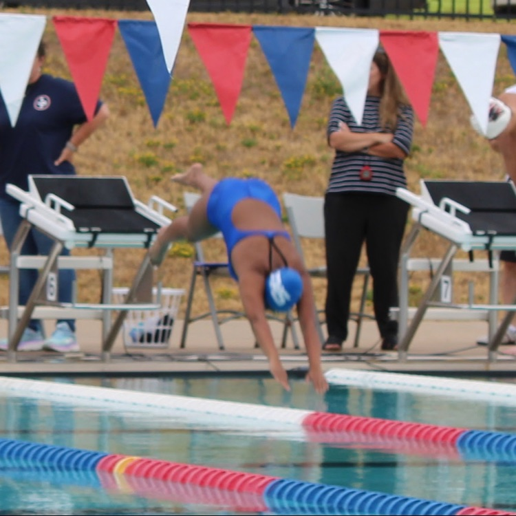 Swimmer diving in pool